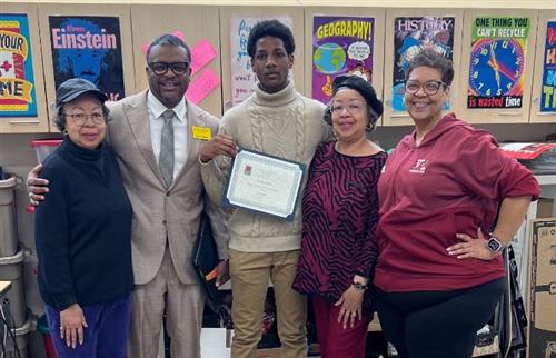  S. Dinkins and his teacher and another group of people posing